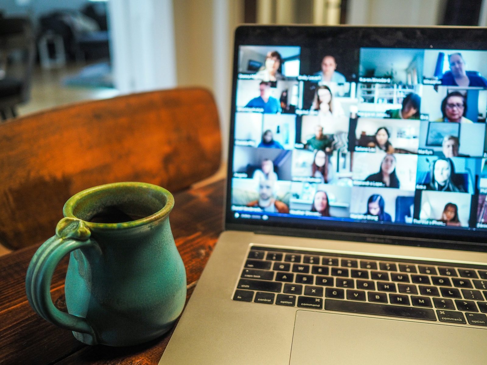 A multi-person video conference call on a laptop screen